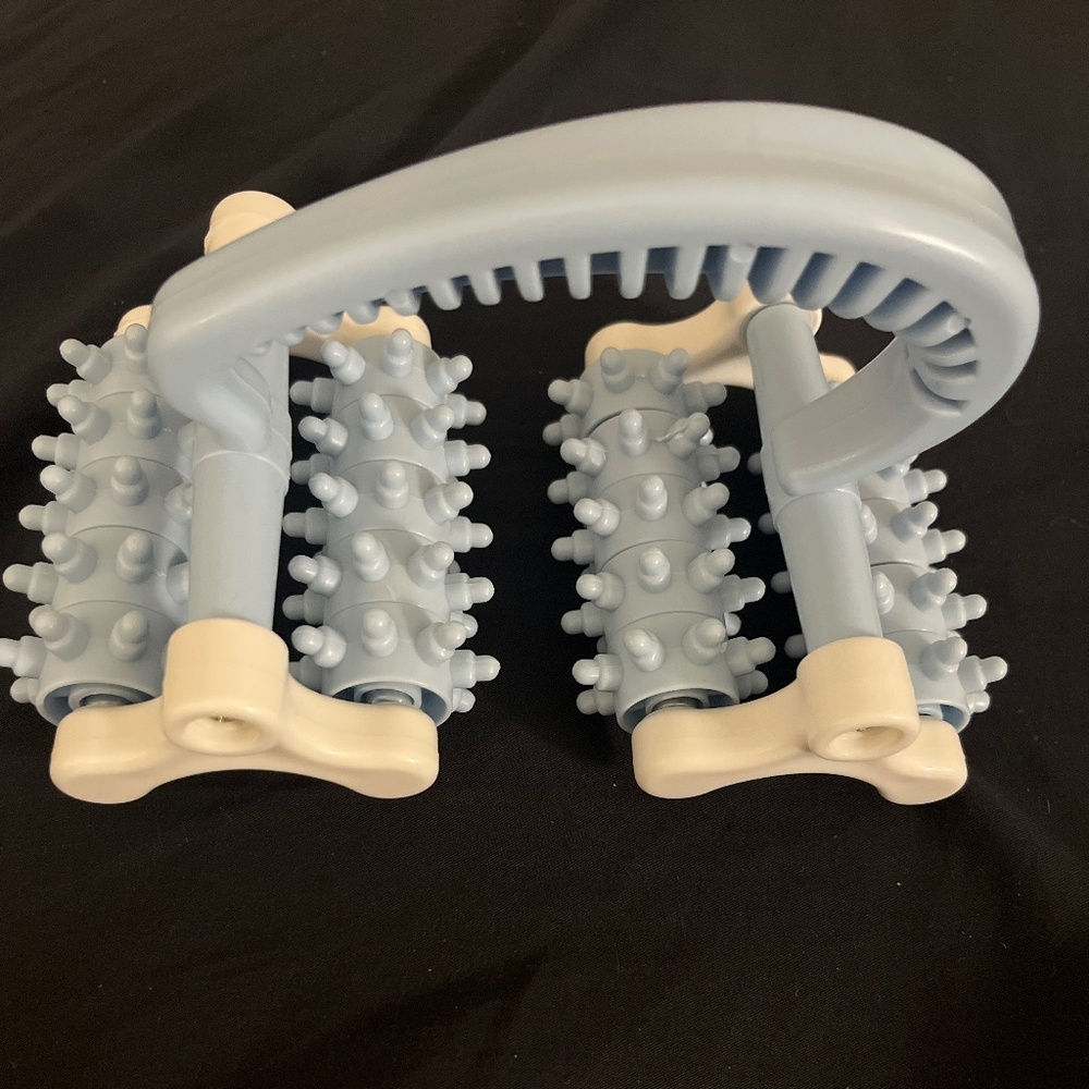 Hand held massage roller